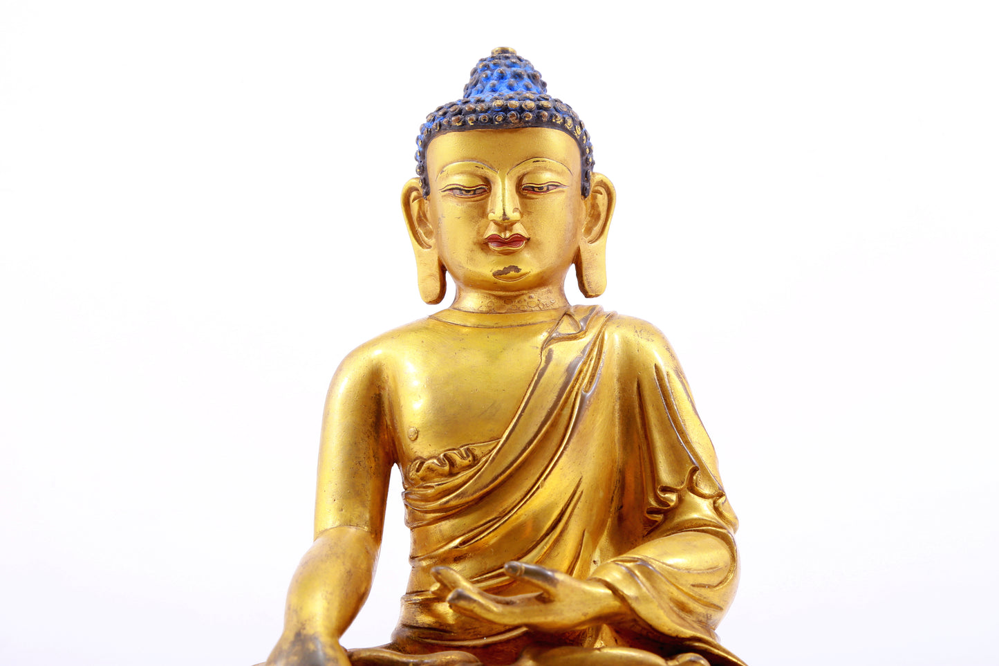 A gilt bronze statue of Gautama Buddha