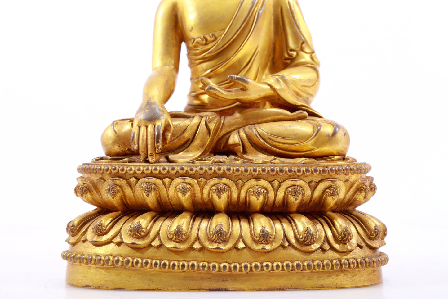 A gilt bronze statue of Gautama Buddha