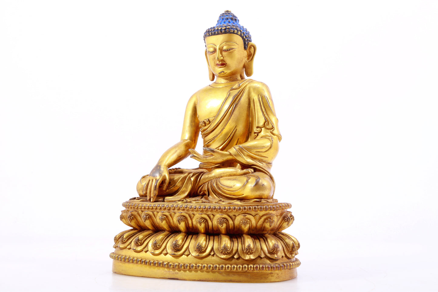 A gilt bronze statue of Gautama Buddha