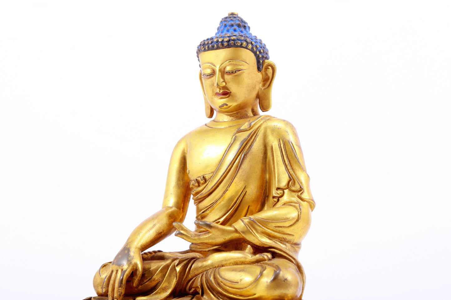 A gilt bronze statue of Gautama Buddha