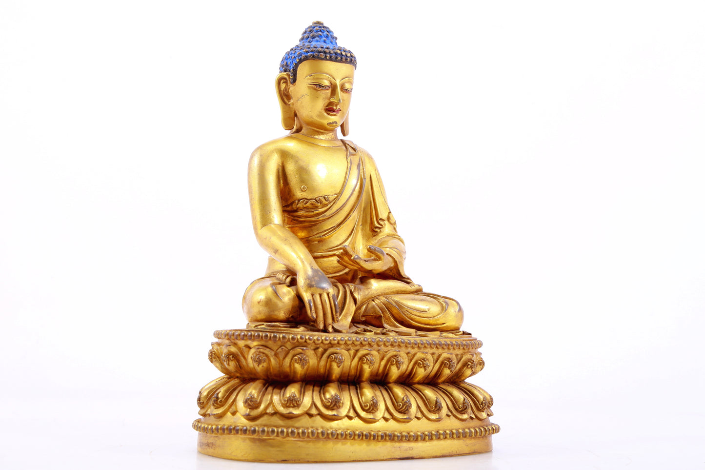 A gilt bronze statue of Gautama Buddha