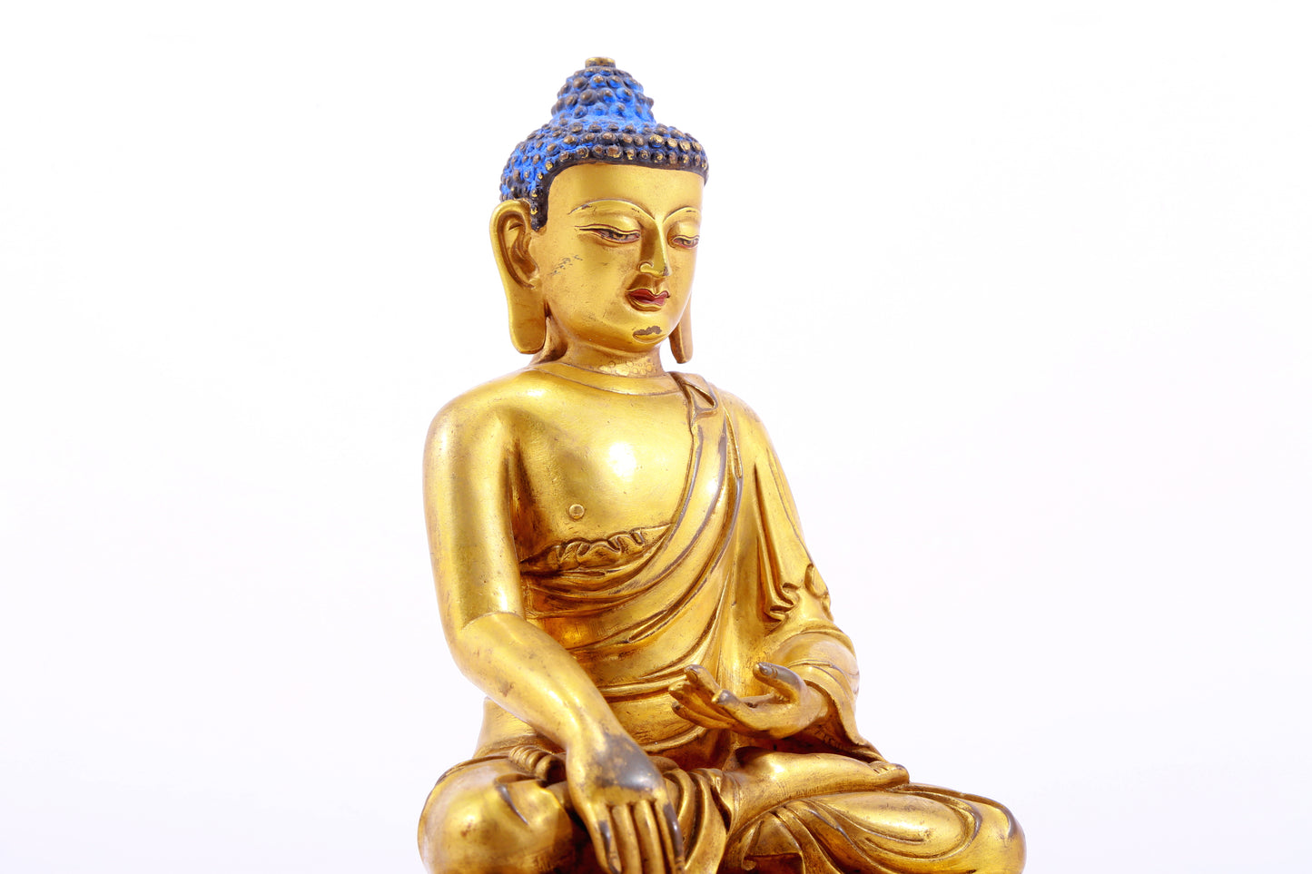 A gilt bronze statue of Gautama Buddha