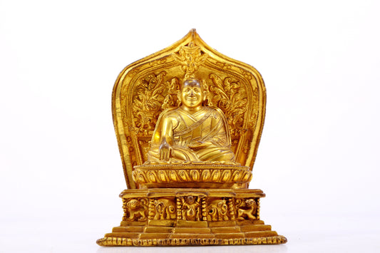 A gilt bronze statue of the guru