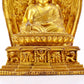 A gilt bronze statue of the guru