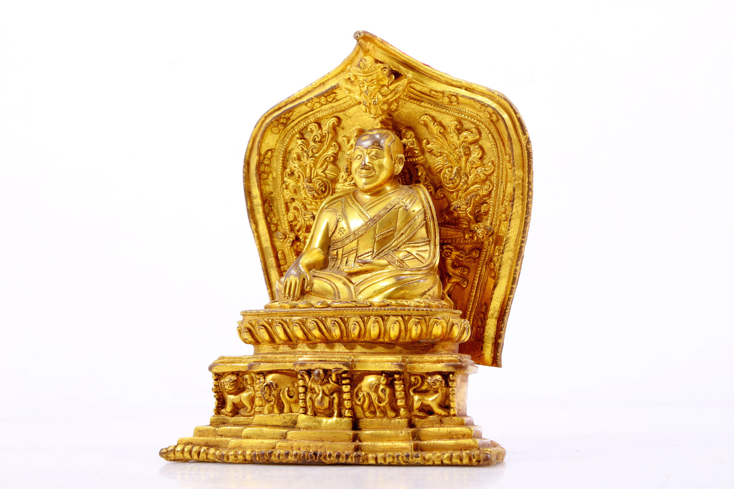 A gilt bronze statue of the guru