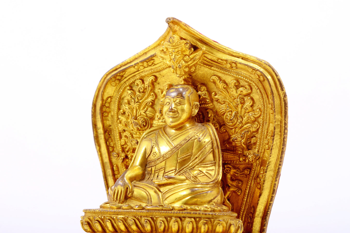 A gilt bronze statue of the guru