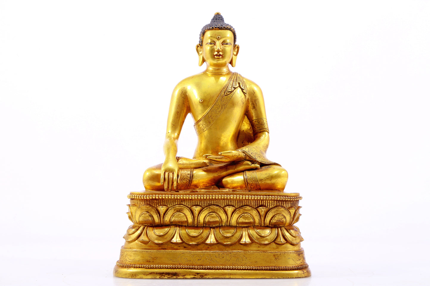 A gilt bronze statue of Gautama Buddha