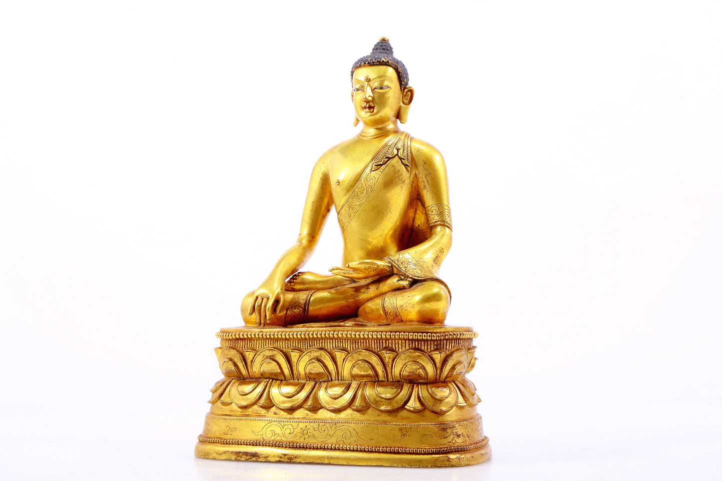 A gilt bronze statue of Gautama Buddha