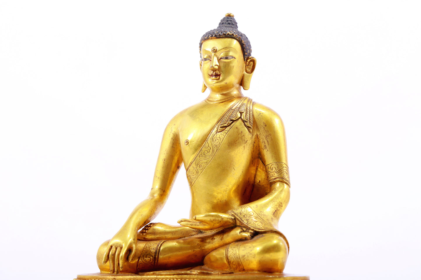 A gilt bronze statue of Gautama Buddha