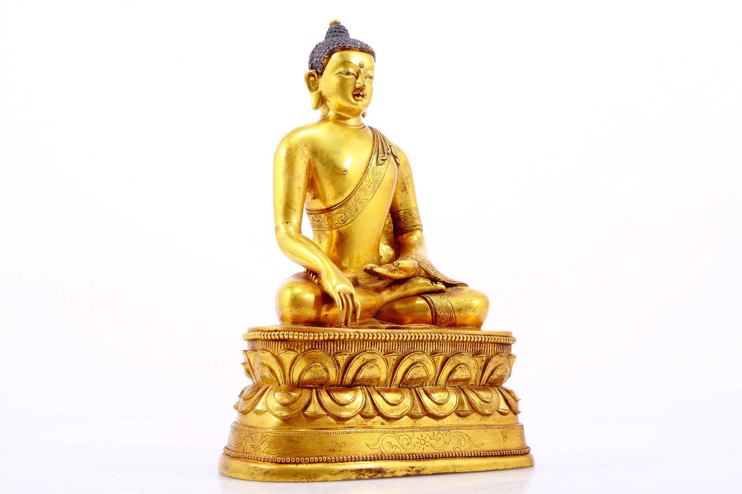 A gilt bronze statue of Gautama Buddha