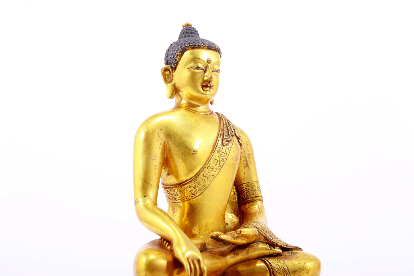 A gilt bronze statue of Gautama Buddha