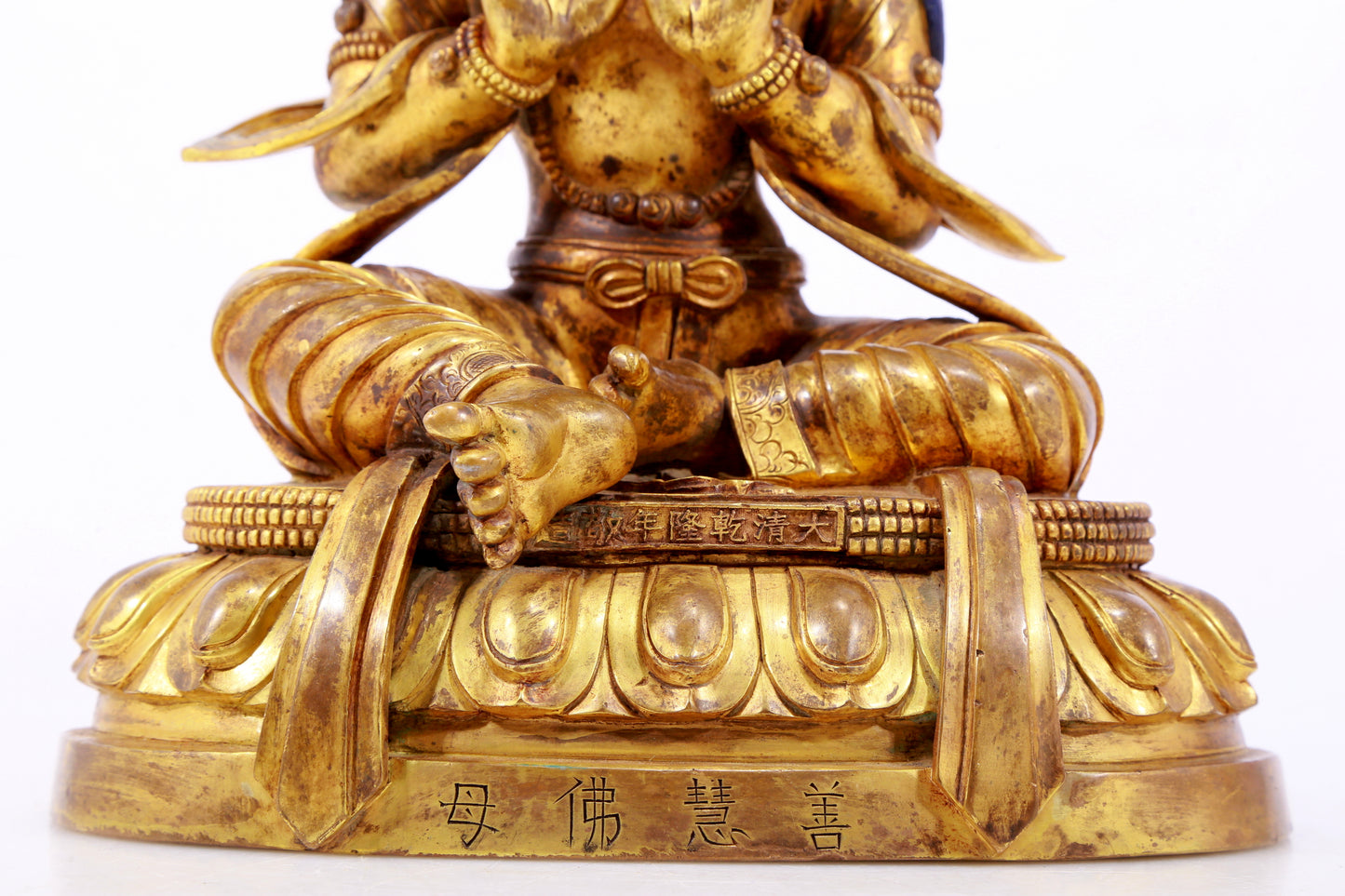 A gilt bronze statue of the Buddha