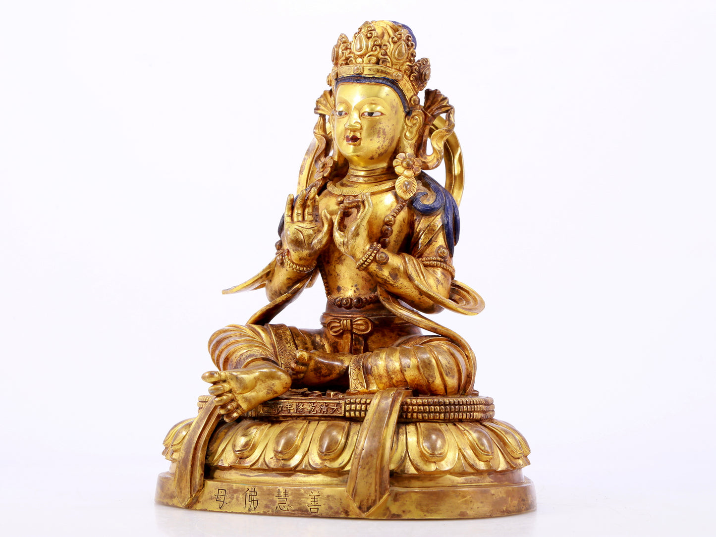 A gilt bronze statue of the Buddha