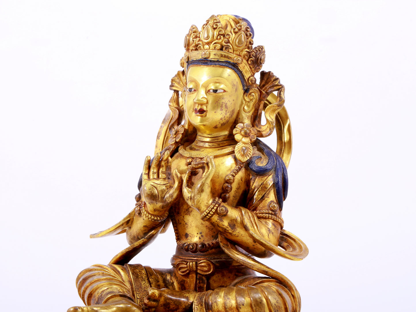 A gilt bronze statue of the Buddha