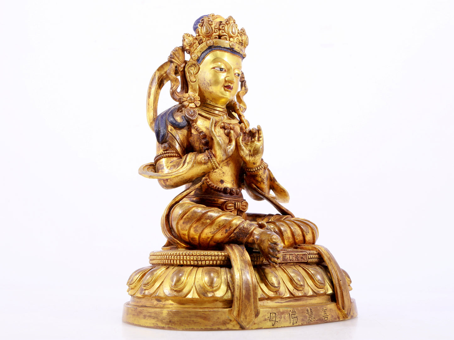 A gilt bronze statue of the Buddha