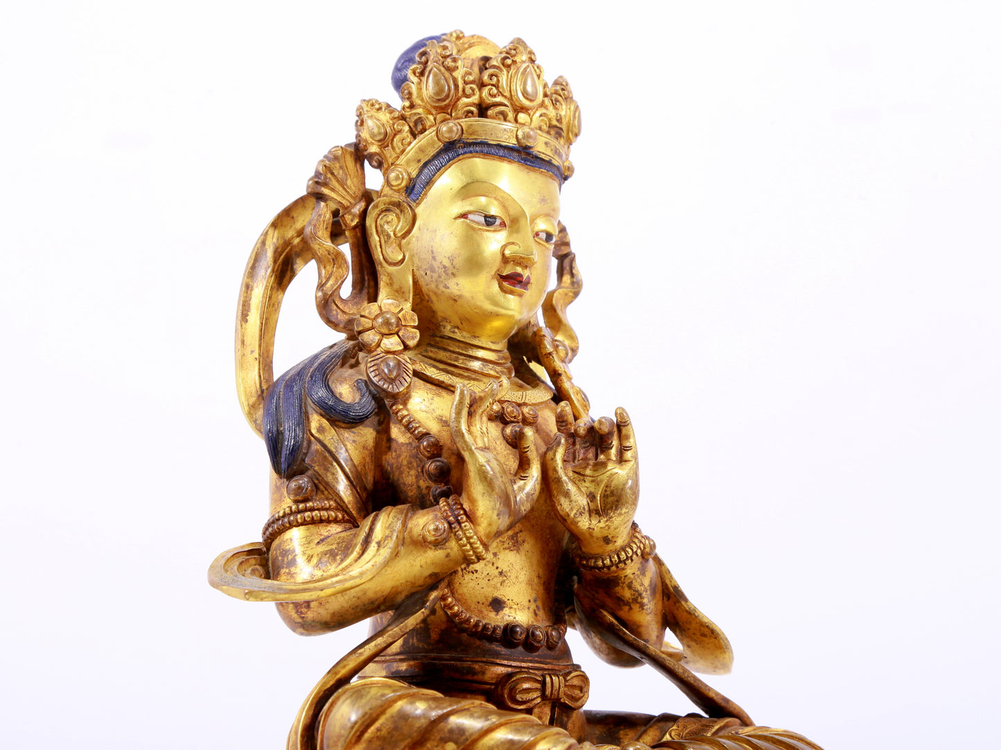 A gilt bronze statue of the Buddha