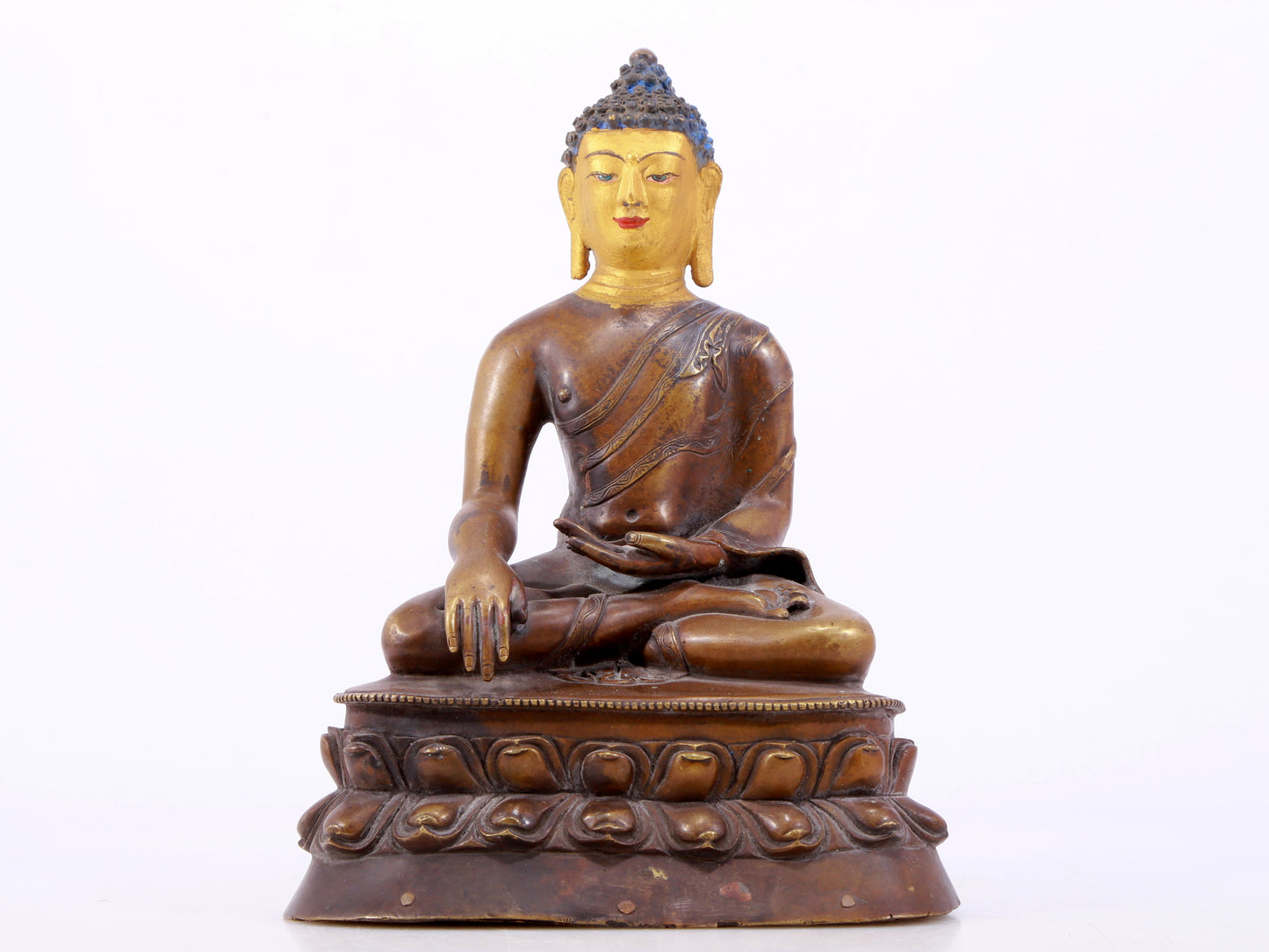 A gilt bronze statue of Gautama Buddha