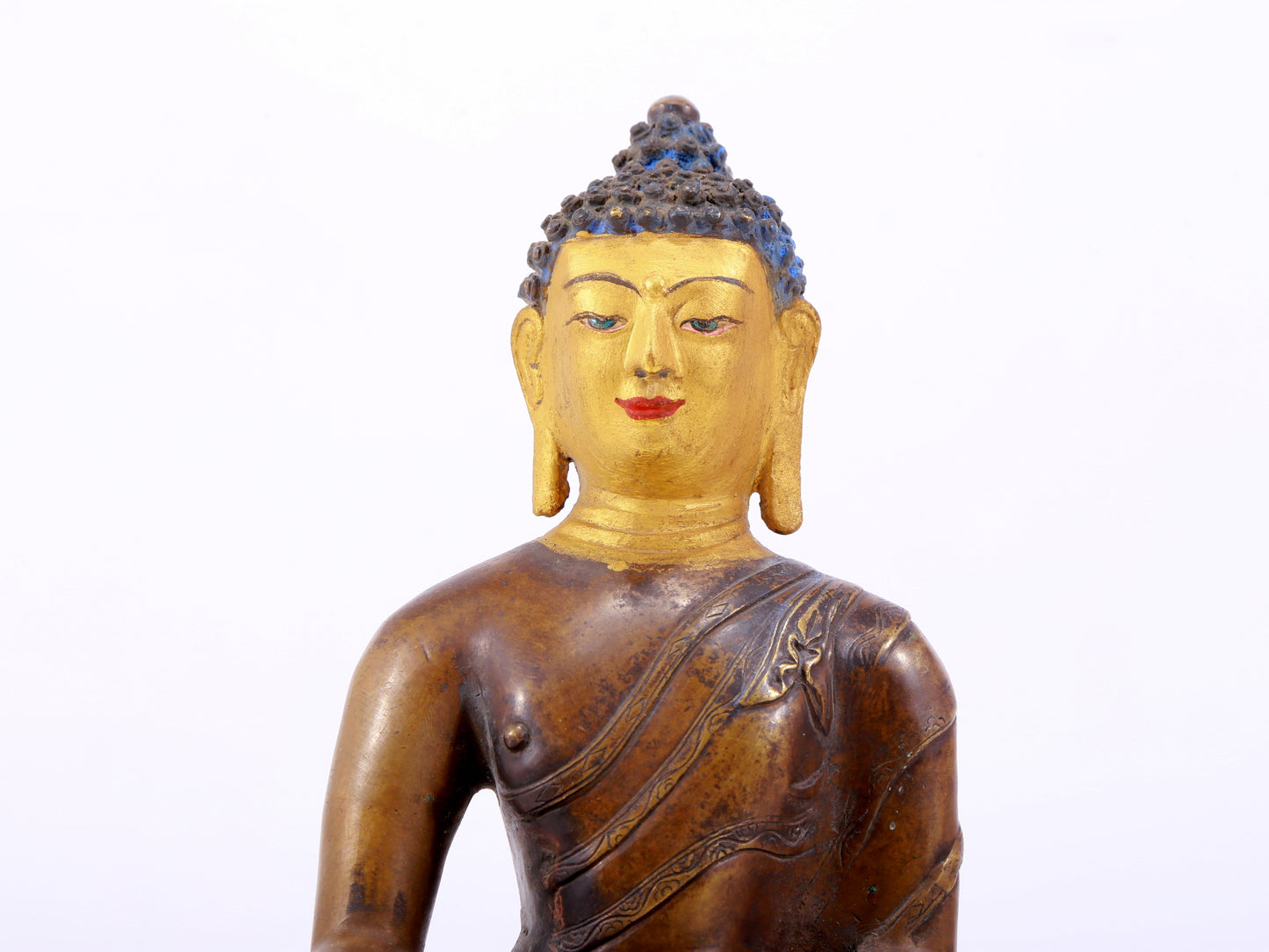 A gilt bronze statue of Gautama Buddha