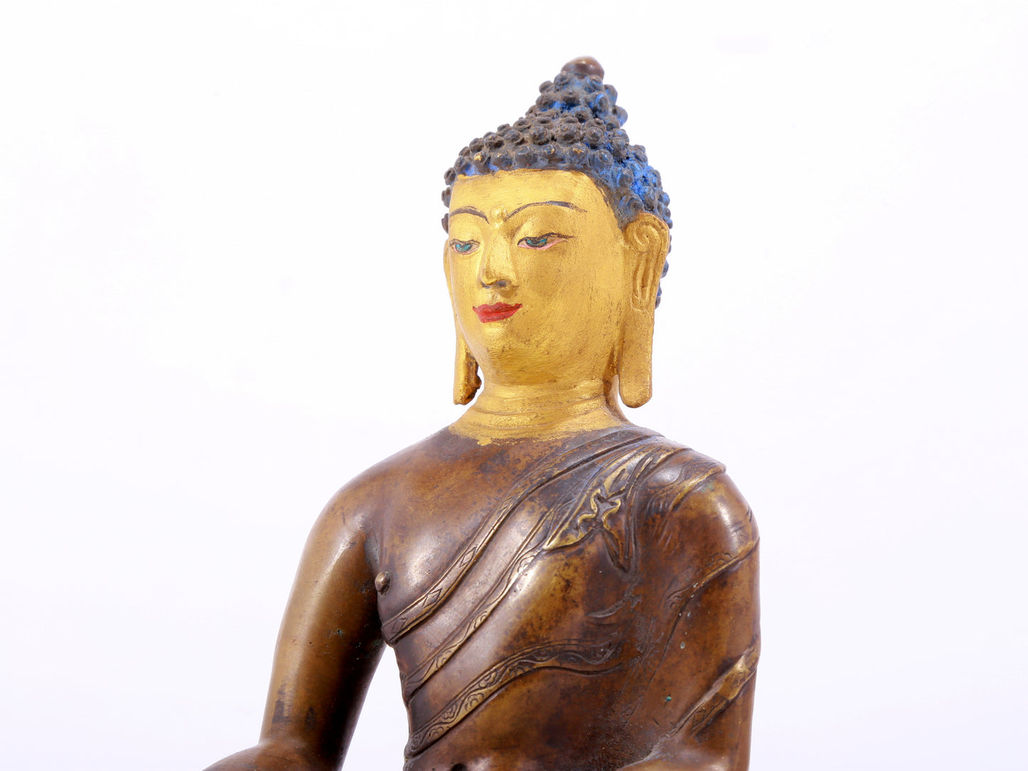 A gilt bronze statue of Gautama Buddha