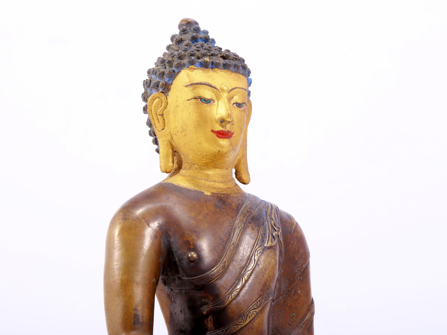 A gilt bronze statue of Gautama Buddha