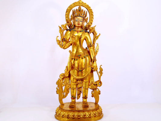 A gilt bronze statue of Tara inlaid with hundreds of treasures