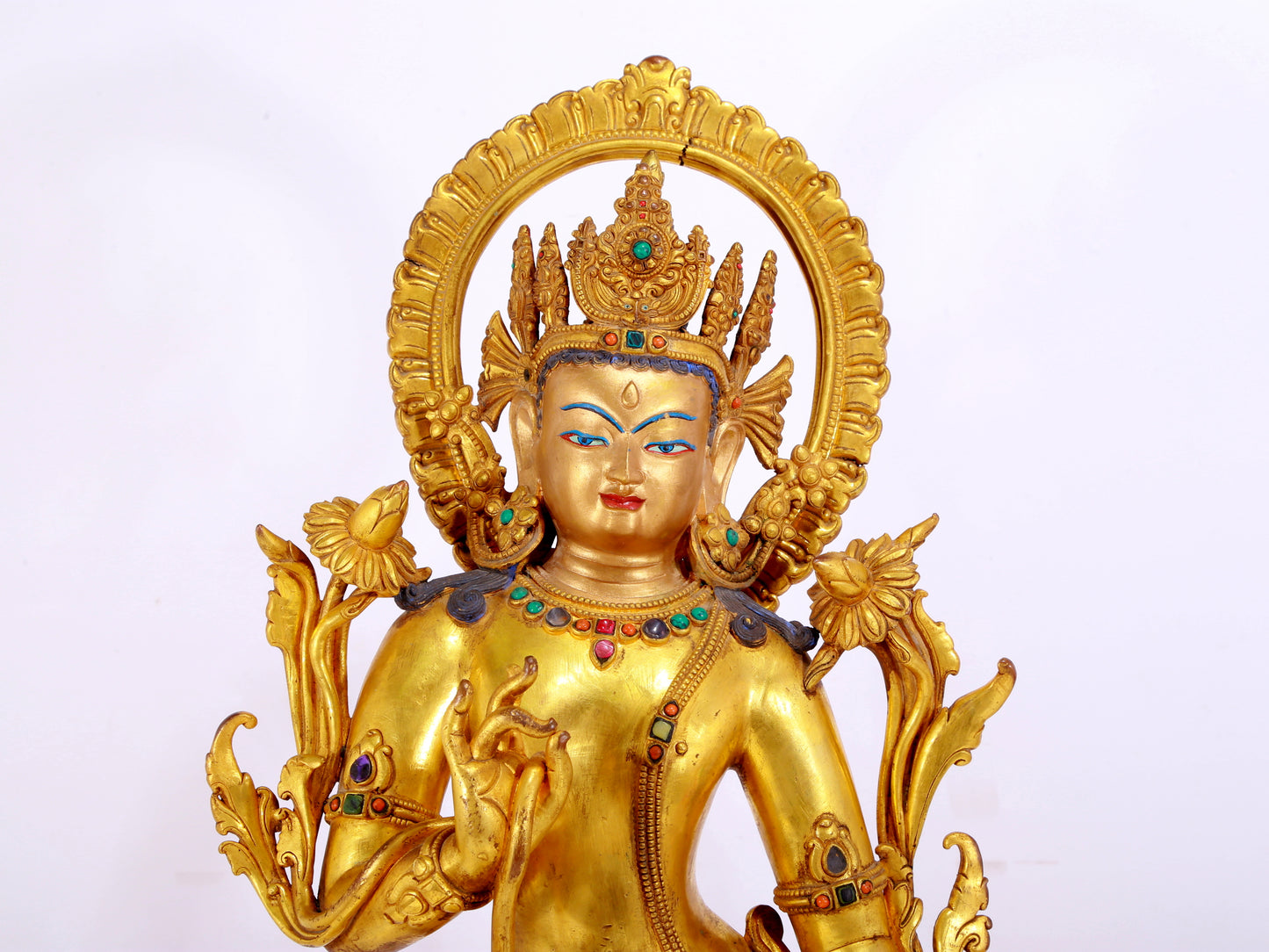 A gilt bronze statue of Tara inlaid with hundreds of treasures