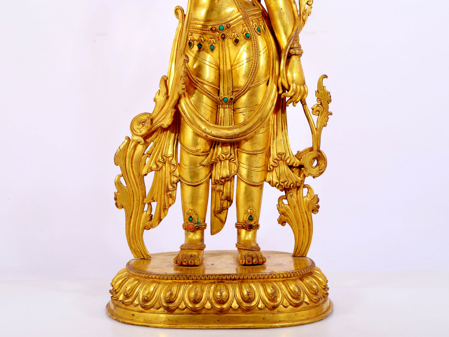 A gilt bronze statue of Tara inlaid with hundreds of treasures