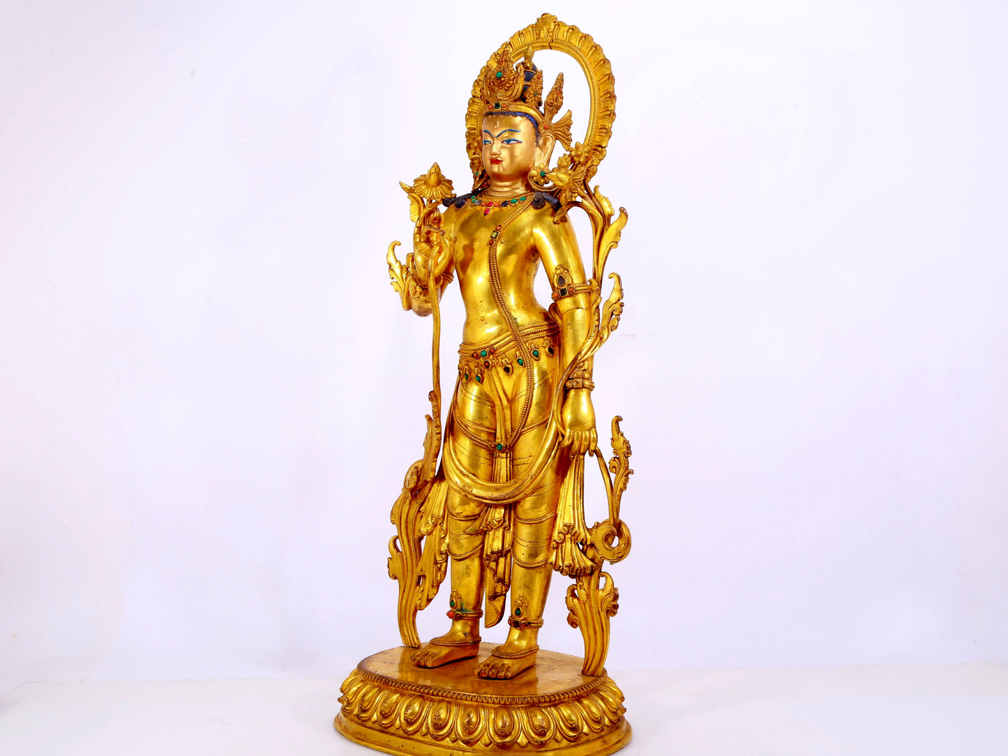 A gilt bronze statue of Tara inlaid with hundreds of treasures