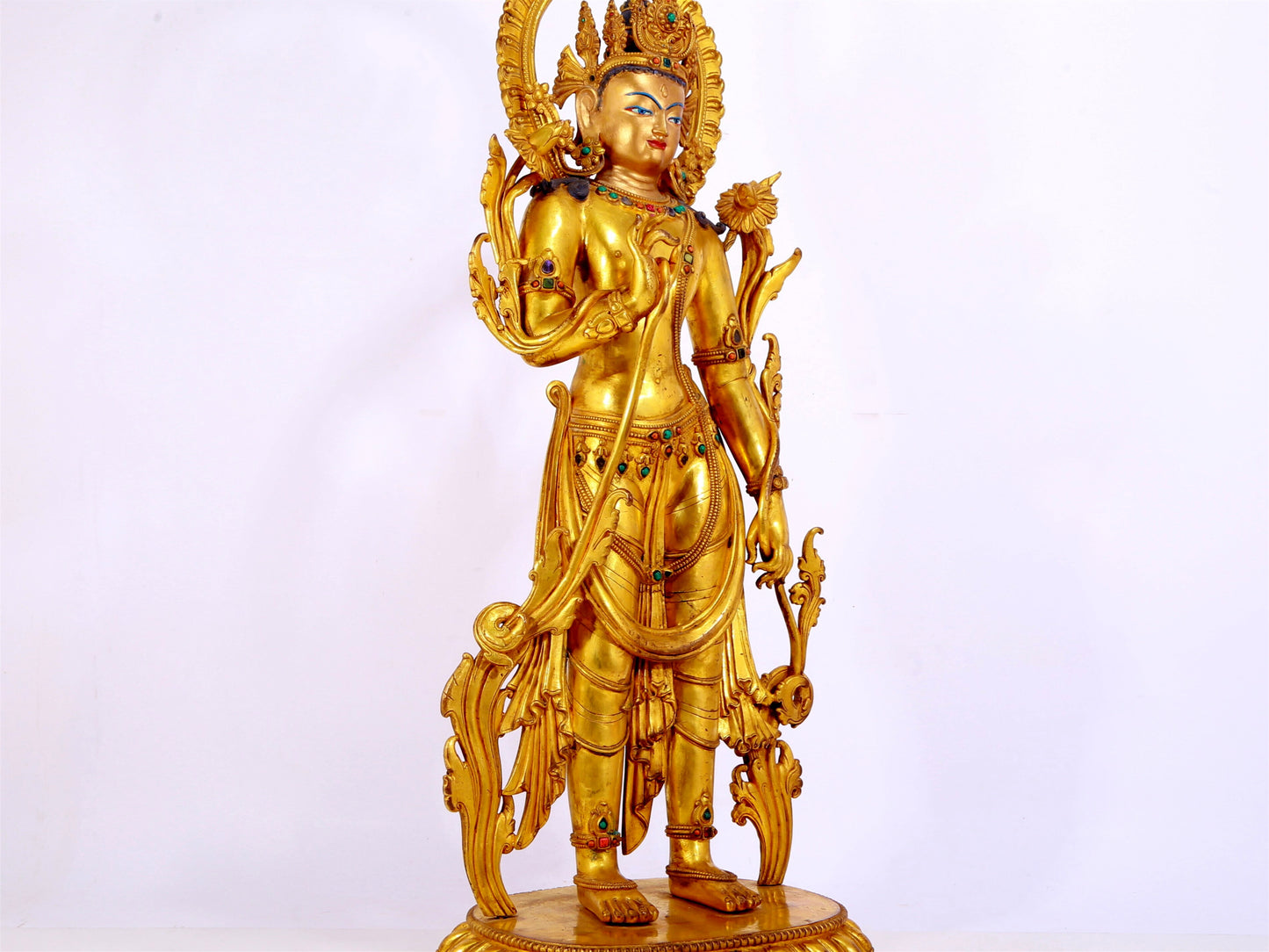 A gilt bronze statue of Tara inlaid with hundreds of treasures