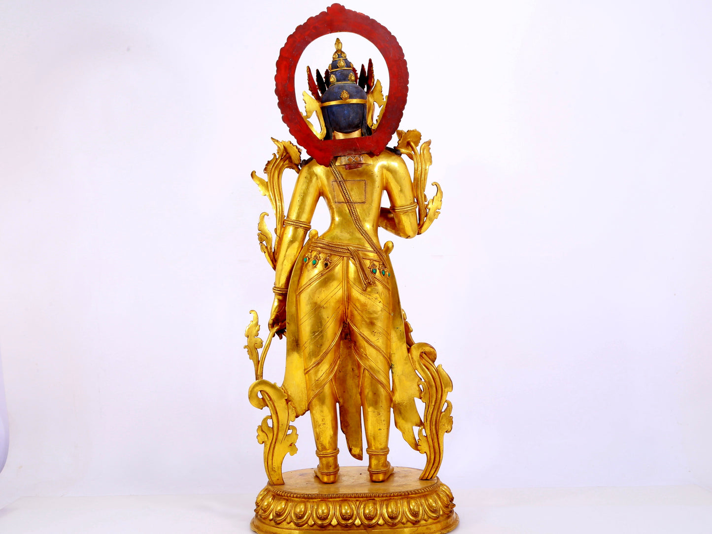 A gilt bronze statue of Tara inlaid with hundreds of treasures