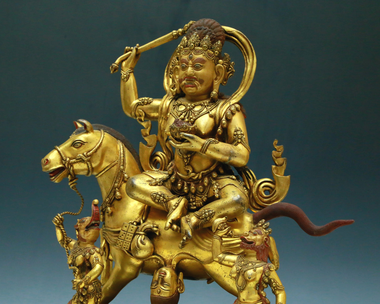 A Wonderful Gilt-Bronze Figure Of Kubera Seated On A Horse