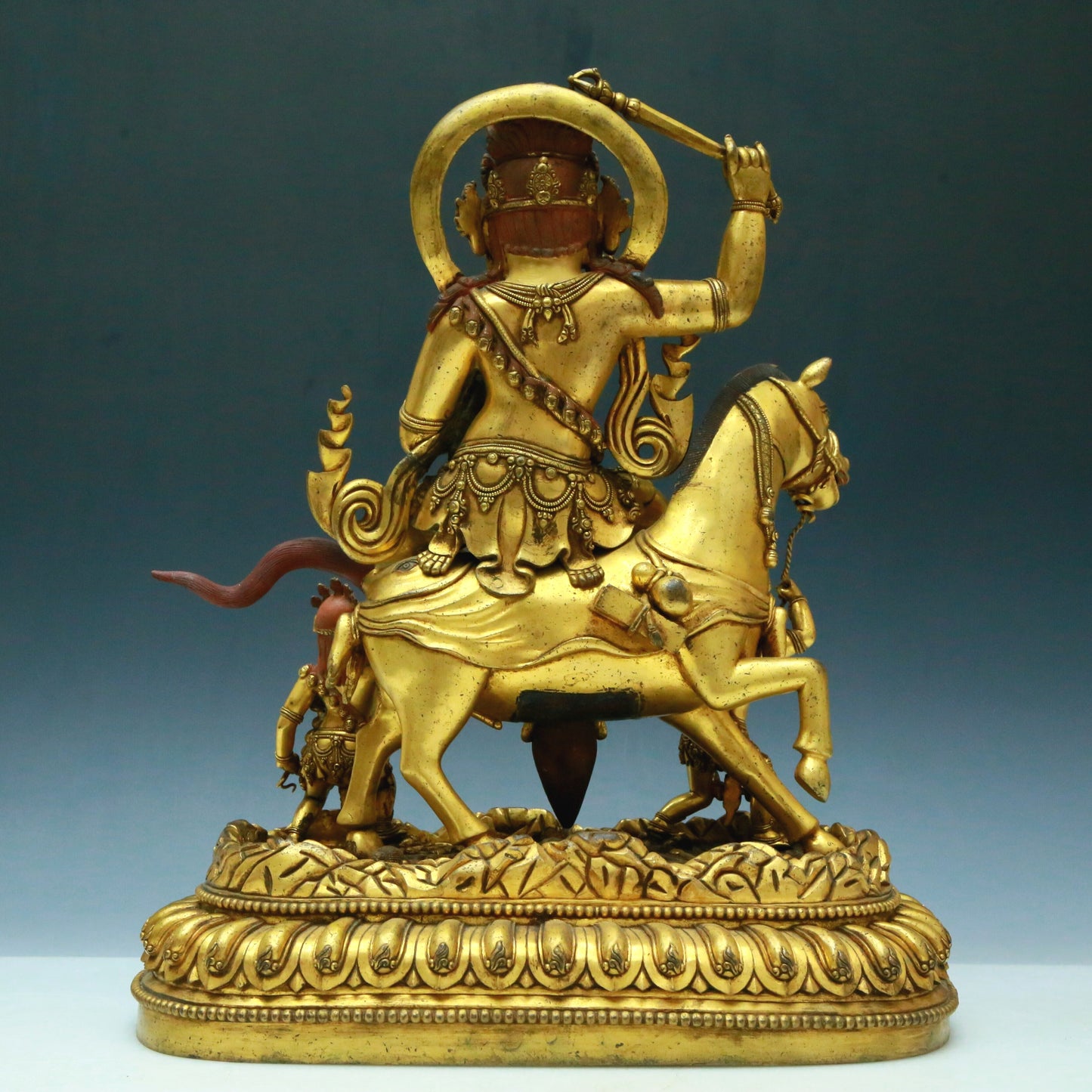 A Wonderful Gilt-Bronze Figure Of Kubera Seated On A Horse