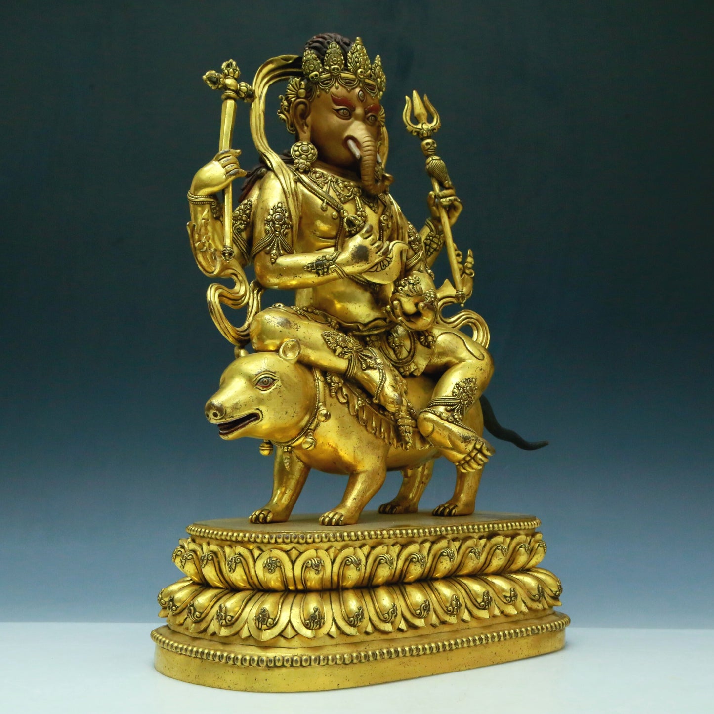 A Wonderful Gilt-Bronze Figure Of Kubera With An Elephant's Trunk
