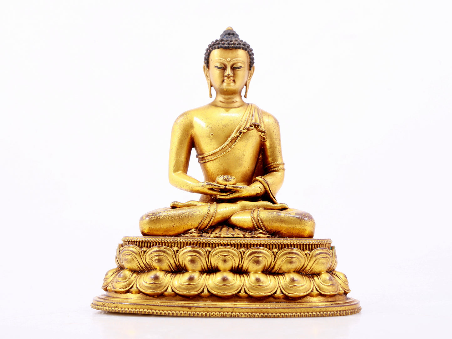 A majestic gilt bronze statue of Sakyamuni