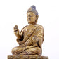 solemn bronze statue of Gautama Buddha