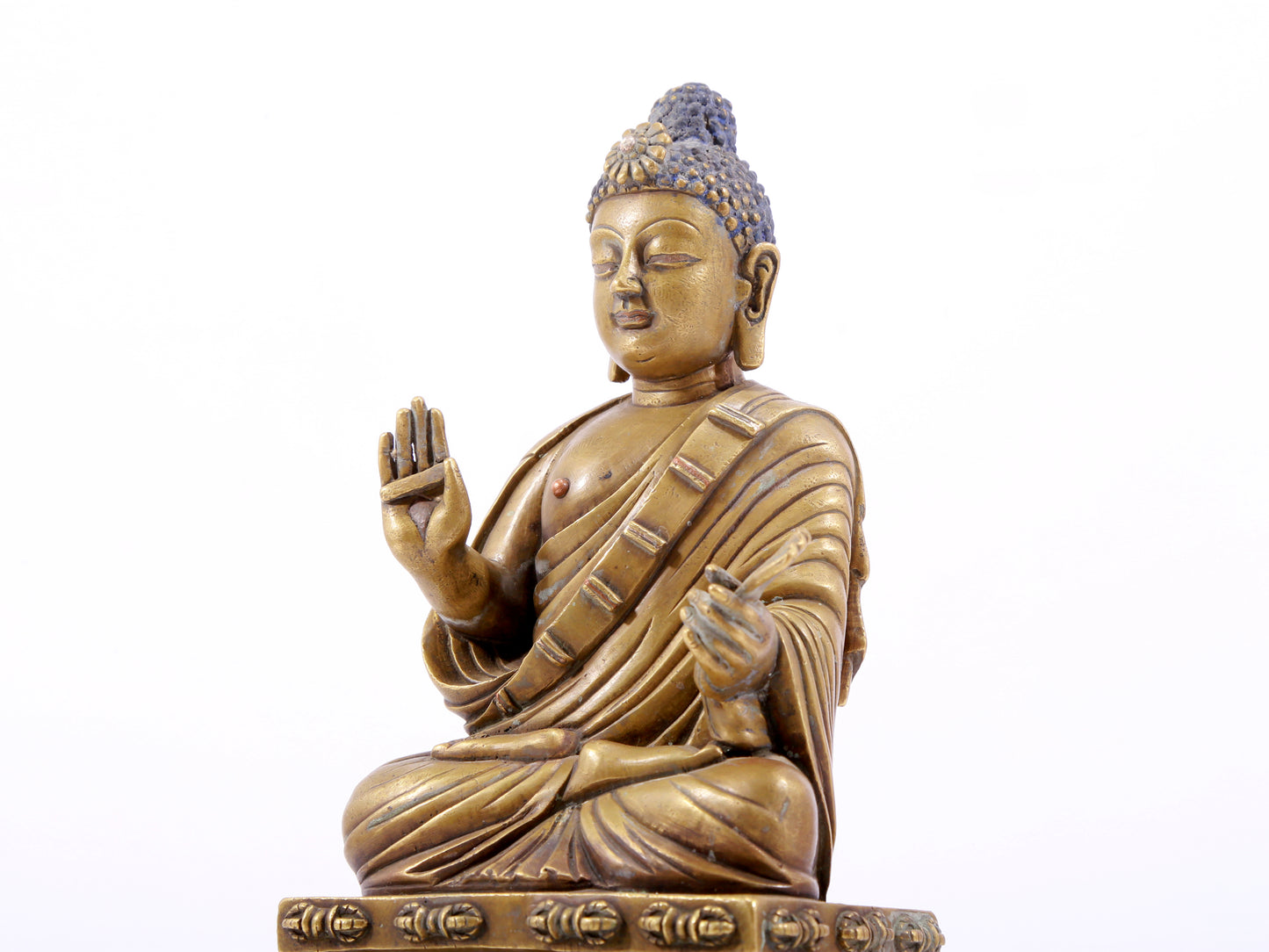 solemn bronze statue of Gautama Buddha