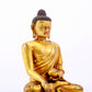 A majestic gilt bronze statue of Sakyamuni