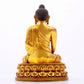 A majestic gilt bronze statue of Sakyamuni