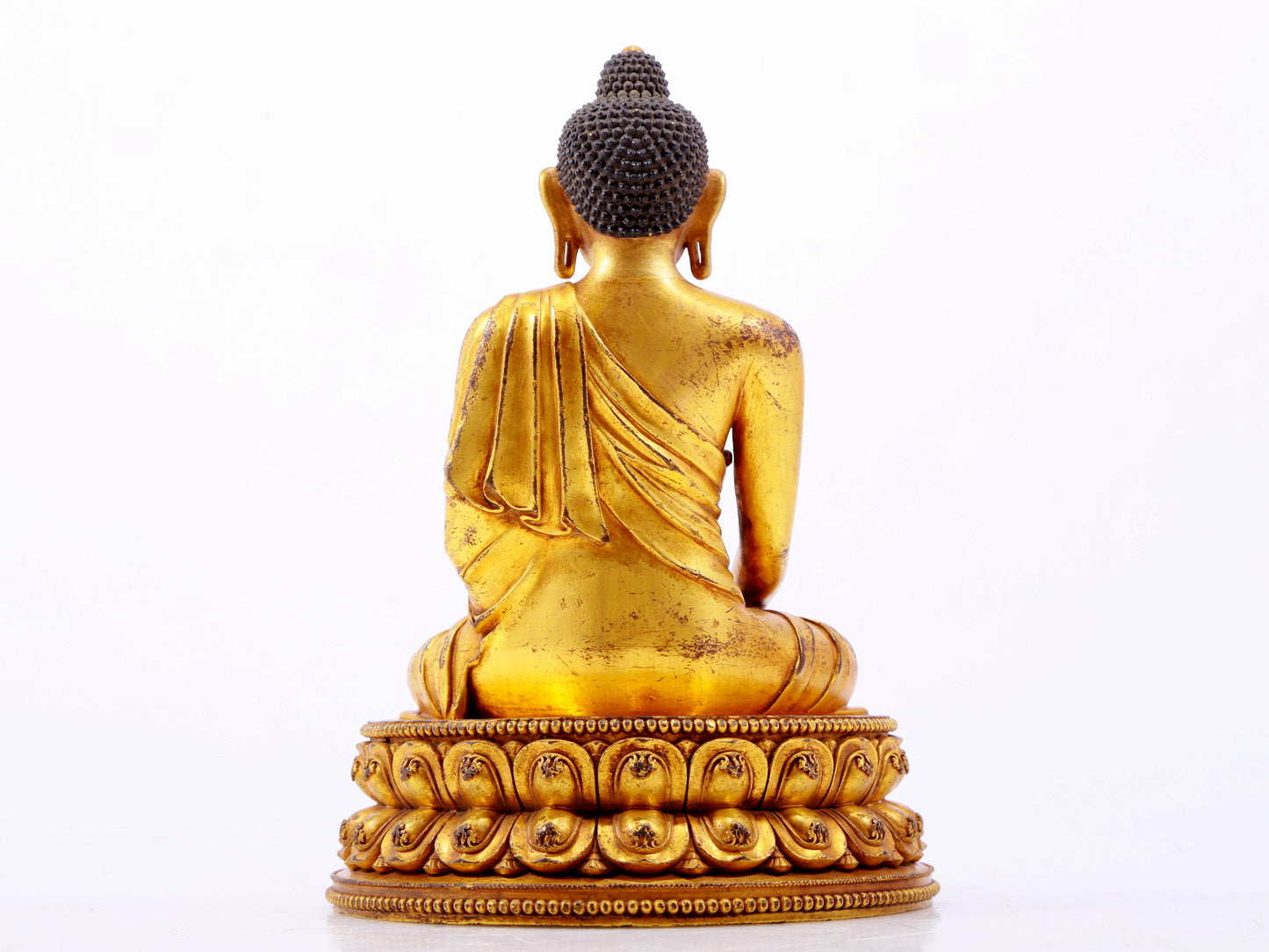 A majestic gilt bronze statue of Sakyamuni