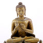 A solemn alloy copper statue of Gautama Buddha