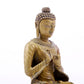 A solemn alloy copper statue of Gautama Buddha