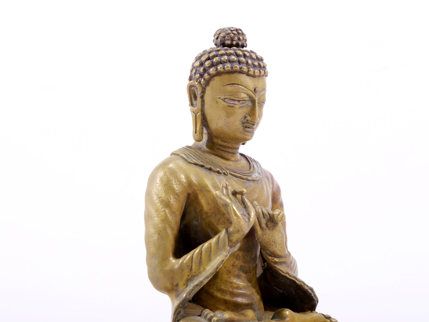 A solemn alloy copper statue of Gautama Buddha