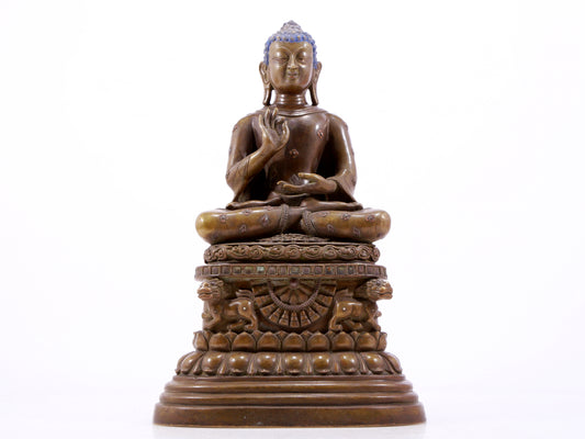 A solemn alloy copper inlaid silver statue of Gautama Buddha