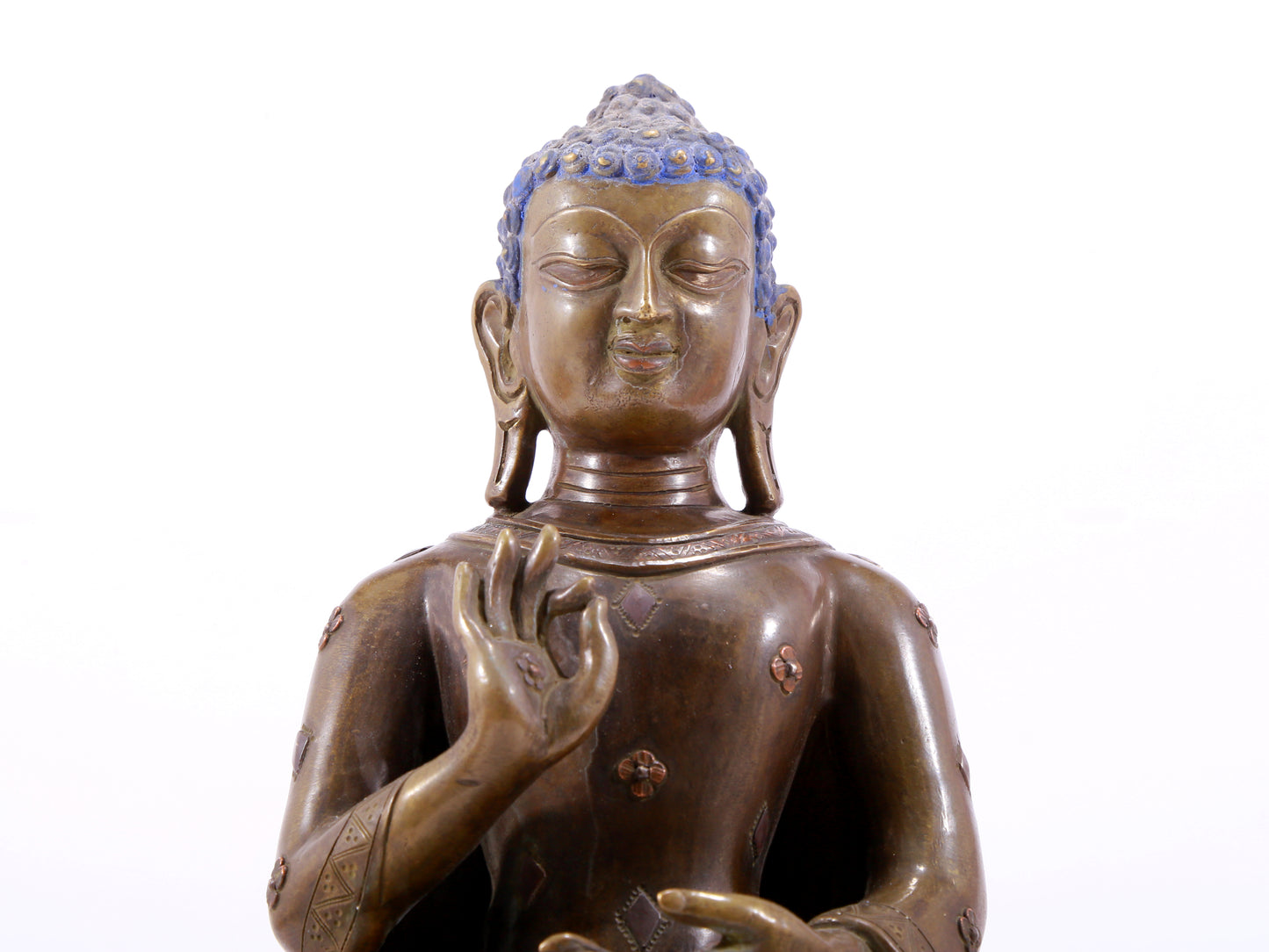 A solemn alloy copper inlaid silver statue of Gautama Buddha