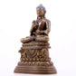 A solemn alloy copper inlaid silver statue of Gautama Buddha