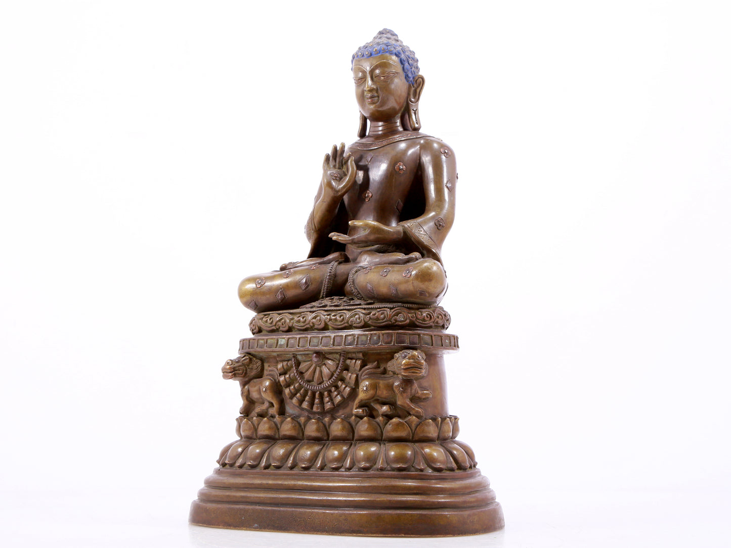 A solemn alloy copper inlaid silver statue of Gautama Buddha