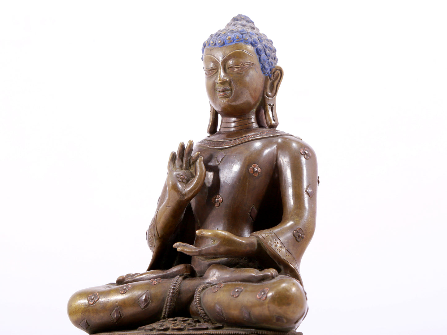 A solemn alloy copper inlaid silver statue of Gautama Buddha