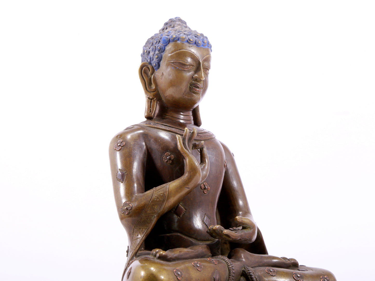 A solemn alloy copper inlaid silver statue of Gautama Buddha