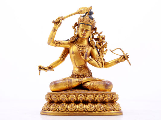 A majestic gilt bronze four-armed Manjushri statue with inscription