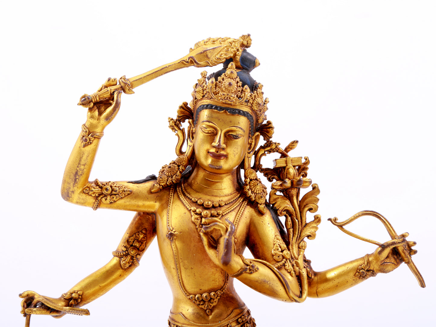 A majestic gilt bronze four-armed Manjushri statue with inscription